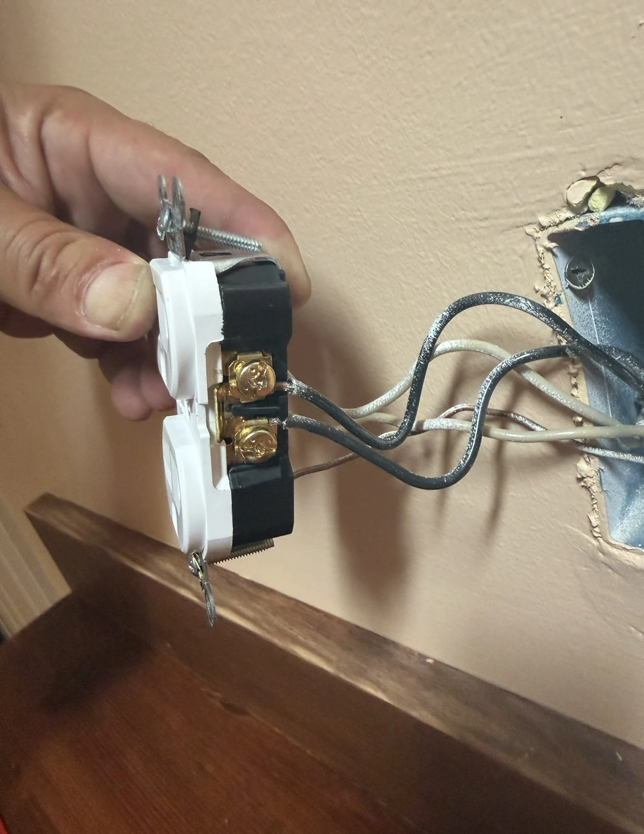 Electrical outlet replacement in progress